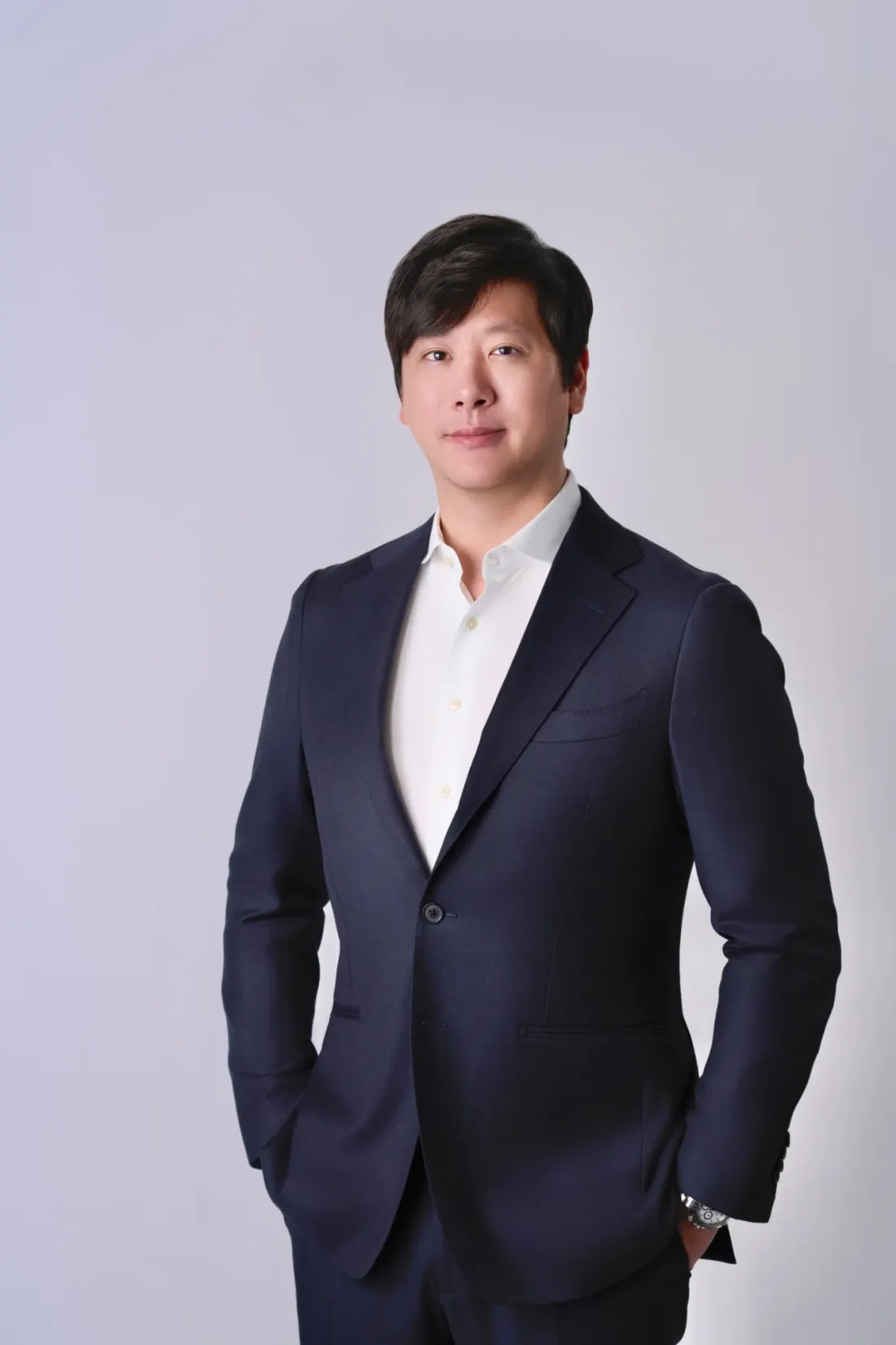 Daniel Kim in a navy suit