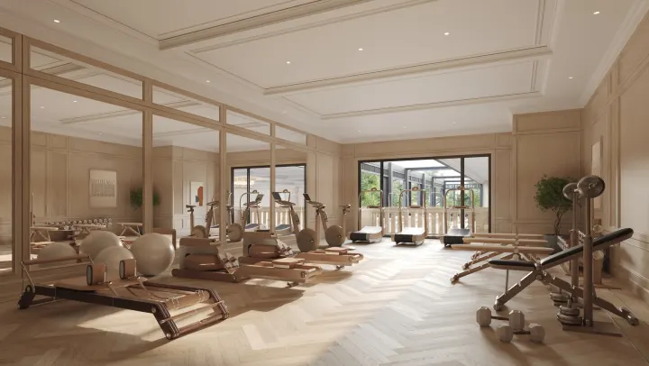 Fitness studio with reformer machines and garden views