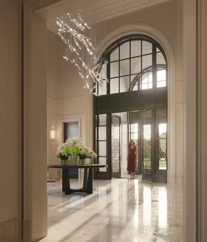 Arched lobby entrance with a sculptural chandelier