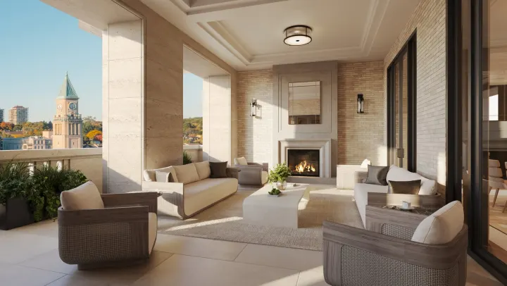 Covered terrace with a fireplace and clock tower view