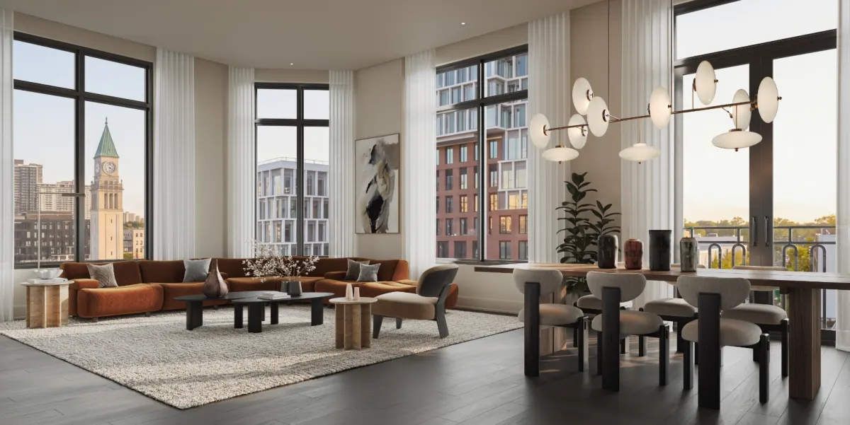 Living room with a sectional sofa opening to a kitchen with island seating